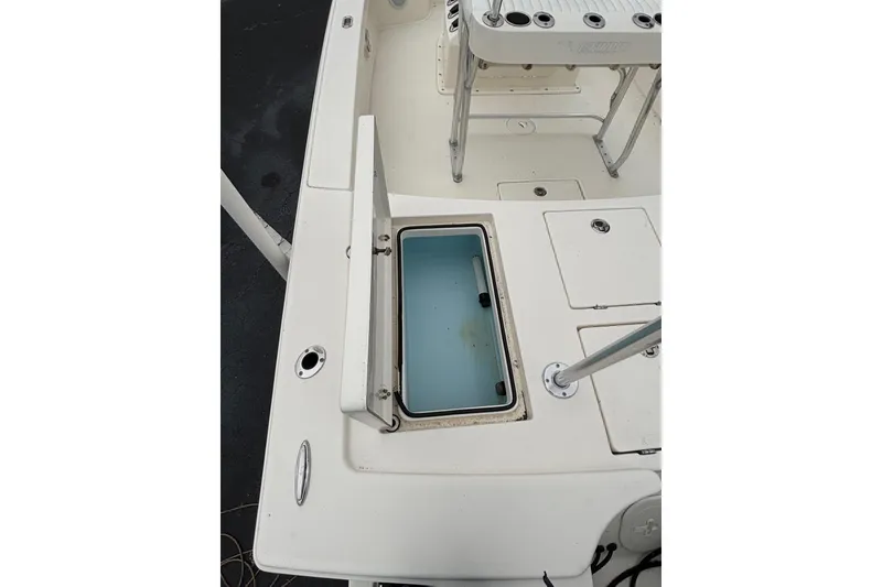 Slide: The Image of 2021 Pathfinder 2300 HPS boat deck with open storage compartment. - 15