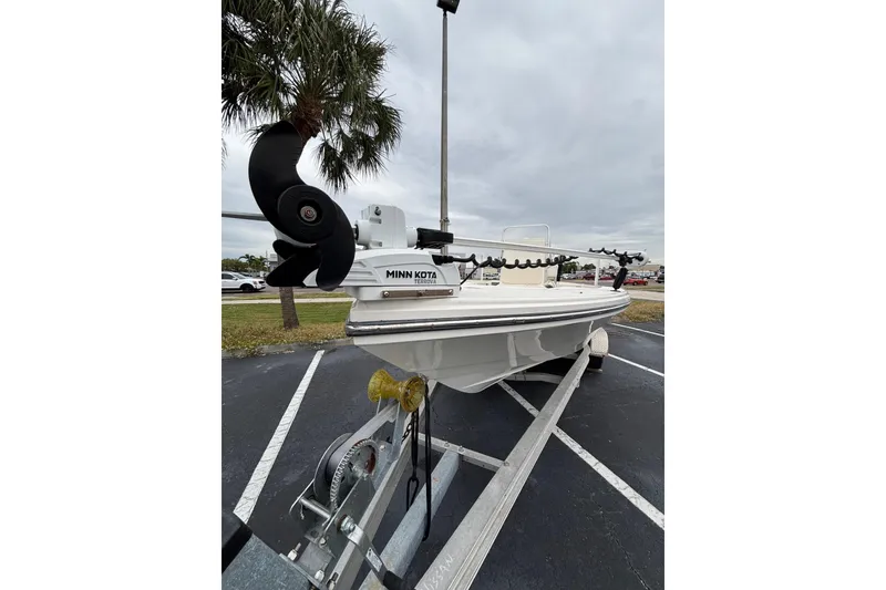 Slide: The Image of 2021 Pathfinder 2300 HPS boat on trailer with Minn Kota motor in parking lot. - 8