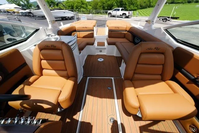 Slide: The Image of Luxurious interior of 2014 Sea Ray 270 SLX boat with tan leather seating. - 15