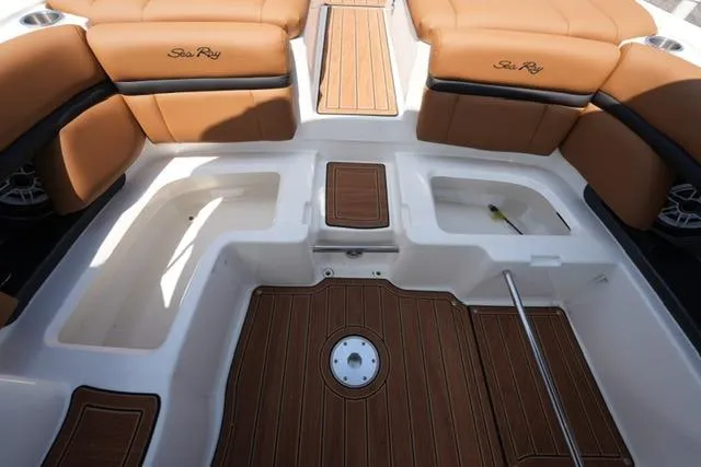 Slide: The Image of 2014 Sea Ray 270 SLX boat interior with tan seating and wood accents. - 17