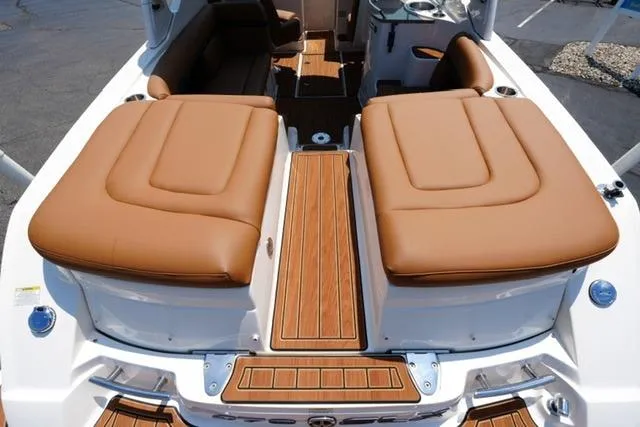 Slide: The Image of 2014 Sea Ray 270 SLX boat with tan leather seating and teak flooring. - 18