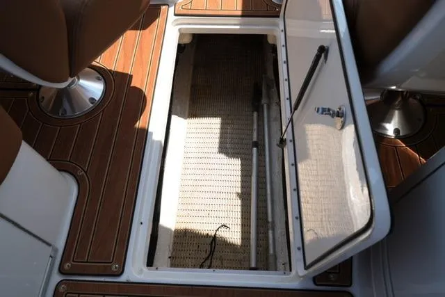 Slide: The Image of Storage compartment on 2014 Sea Ray 270 SLX boat with wooden flooring. - 20