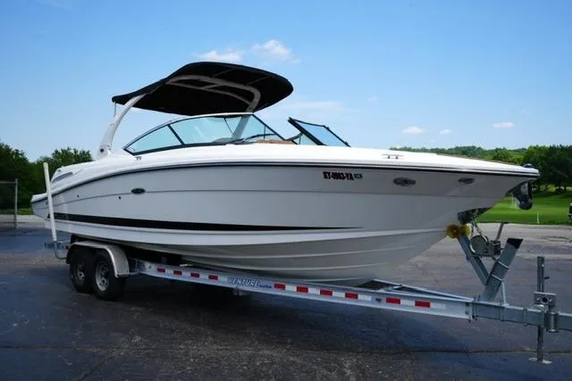 Slide: The Image of 2014 Sea Ray 270 SLX boat on trailer, parked outdoors under clear sky. - 3