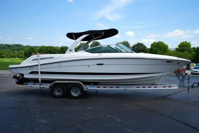 Slide: The Image of 2014 Sea Ray 270 SLX boat on trailer, parked outdoors. - 4