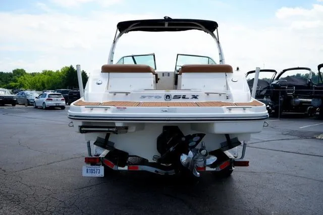 Slide: The Image of 2014 Sea Ray 270 SLX boat on trailer, rear view in parking lot. - 6