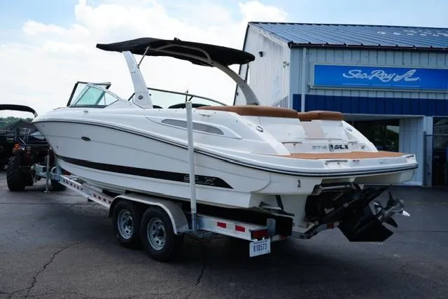 Slide: The Image of 2014 Sea Ray 270 SLX boat on trailer outside dealership. - 7