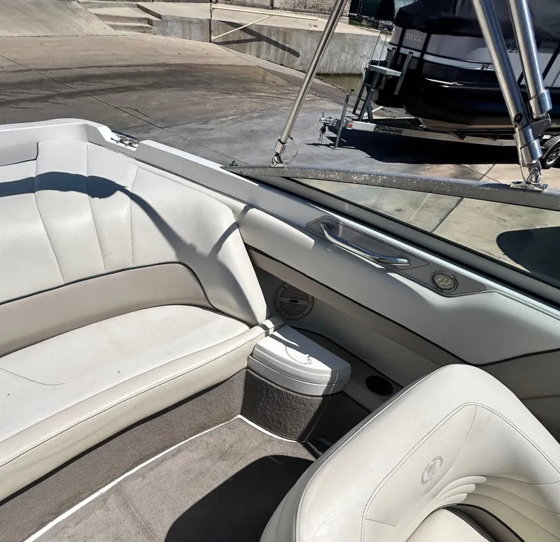 Slide: The Image of Interior of a 1996 Cobalt 232 boat with white leather seats. - 47