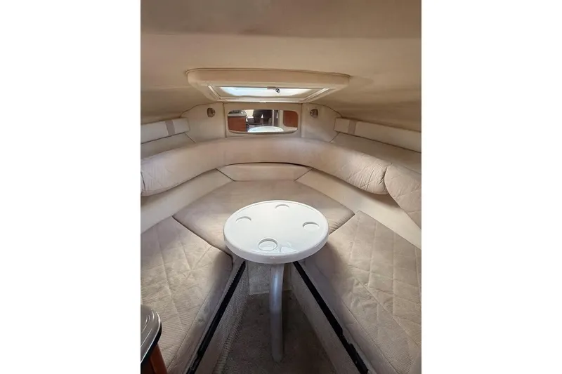 Slide: The Image of Interior cabin of 2007 Sea Ray 240 Sundancer with seating and table. - 10
