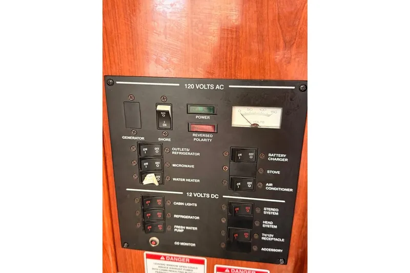 Slide: The Image of Electrical control panel on a 2007 Sea Ray 240 Sundancer boat. - 12