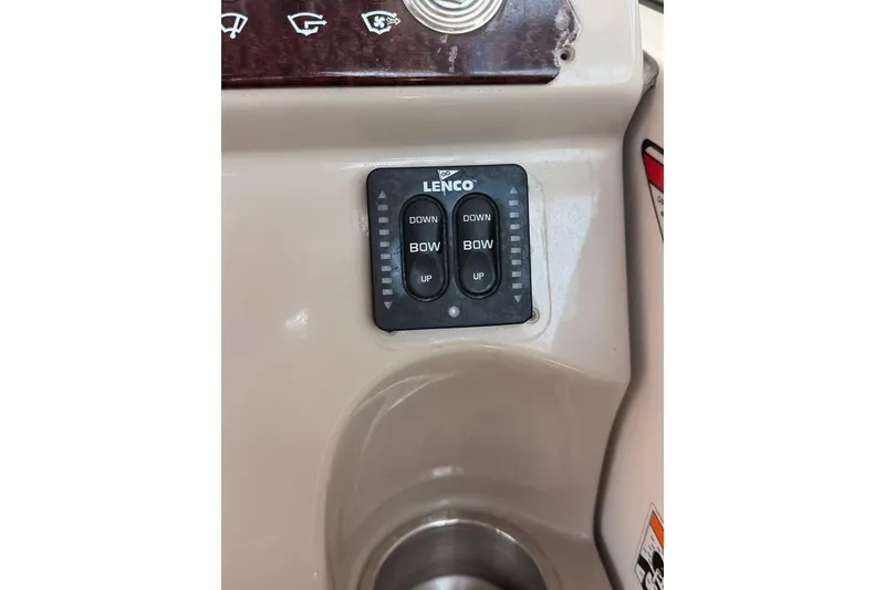 Slide: The Image of Lenco trim tab control panel on 2007 Sea Ray 240 Sundancer boat dashboard. - 16