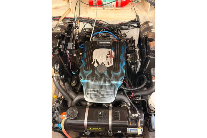 Slide: The Image of Engine of a 2007 Sea Ray 240 Sundancer boat with custom cover design. - 2