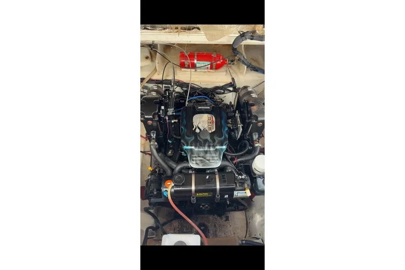 Slide: The Image of Engine of a 2007 Sea Ray 240 Sundancer boat, featuring detailed components. - 3