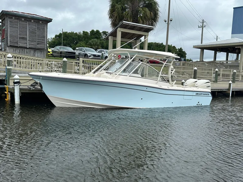 Slide: The Image of Grady-White Freedom 285 boat, 2026 model, docked at marina. - 2