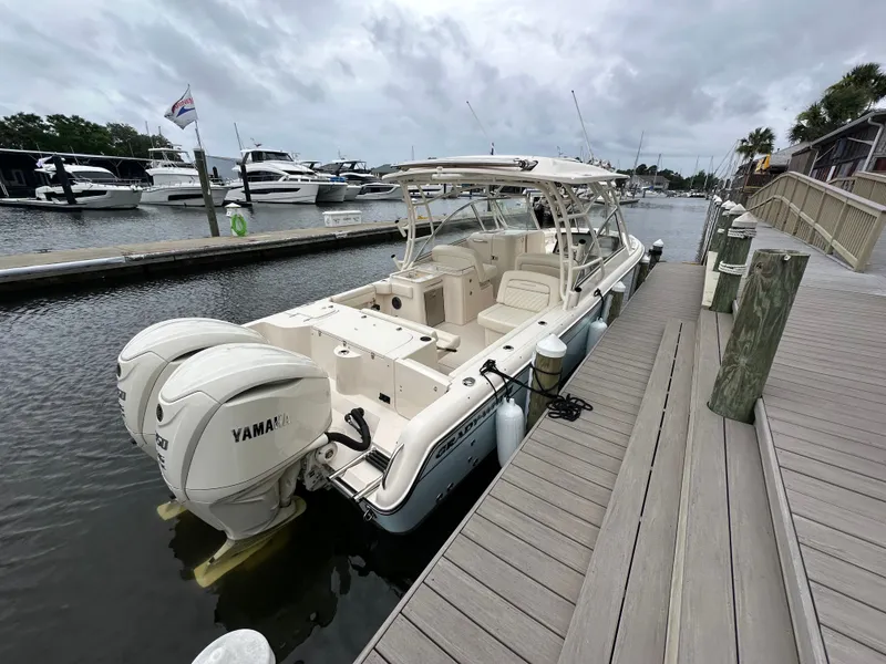 Slide: The Image of Grady-White Freedom 285 boat 2026 at dock with Yamaha engines. - 4