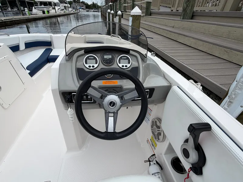 Slide: The Image of Cockpit of a 2018 Chaparral 191 boat docked at marina. - 14