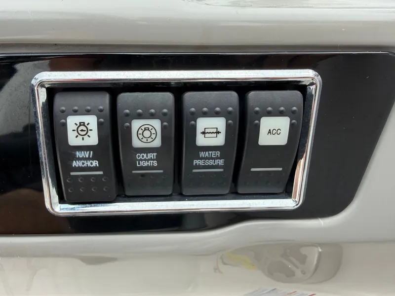 Slide: The Image of Switch panel of a 2018 Chaparral 191 boat. - 18