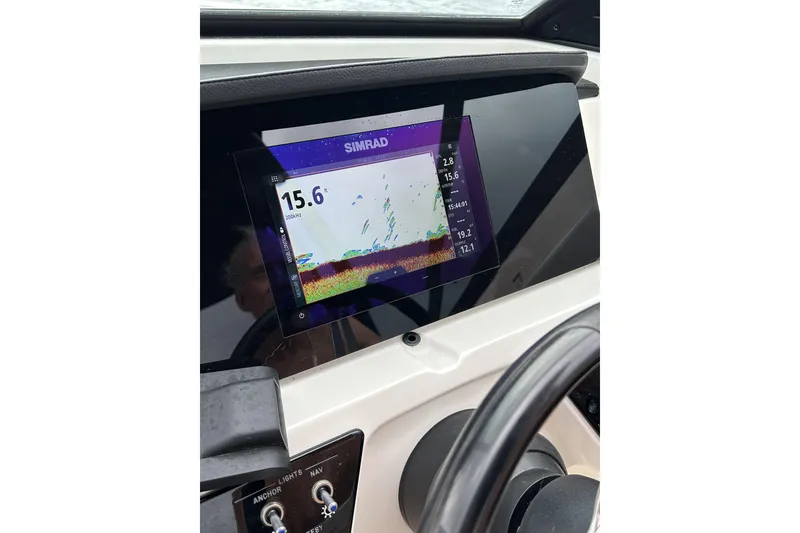 Slide: The Image of Simrad display on 2023 Sea Ray SPX 210 Outboard dashboard showing depth reading. - 10