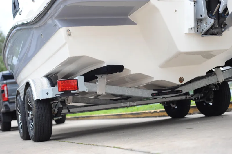 Slide: The Image of 2023 Sea Ray SPX 210 Outboard on trailer, rear view, showcasing hull design. - 4