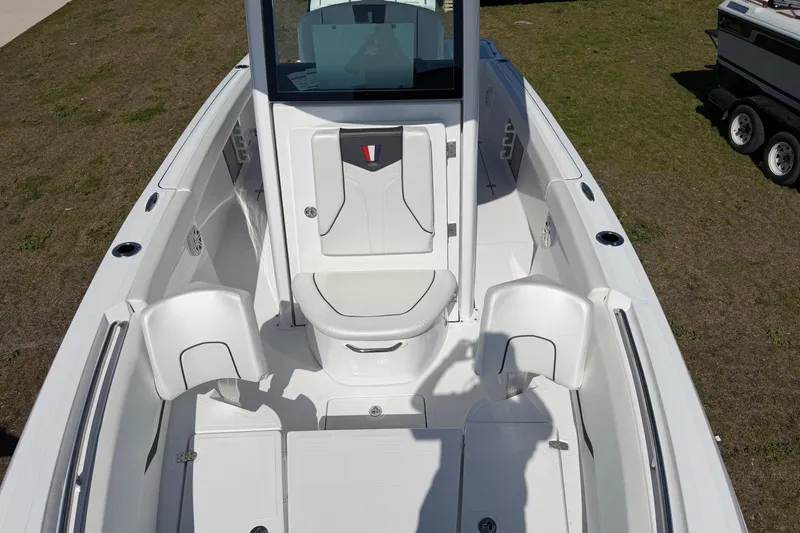 Slide: The Image of 2026 Wellcraft 243 Fisherman boat interior with seating and storage compartments. - 3