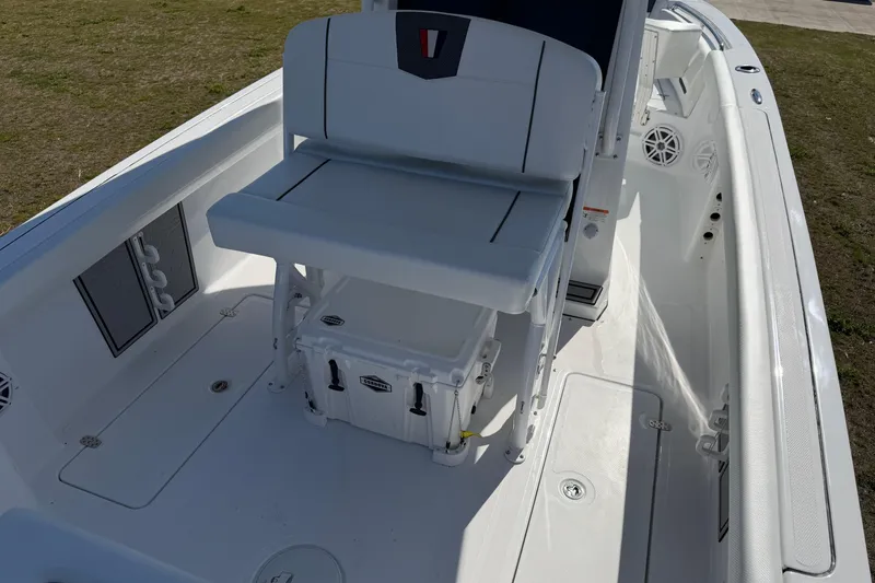 Slide: The Image of 2026 Wellcraft 243 Fisherman boat interior with seating and storage compartments. - 9