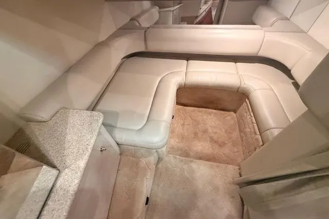 Slide: The Image of 2003 Formula 31 Performance Cruiser interior with beige leather seating and carpeted flooring. - 20