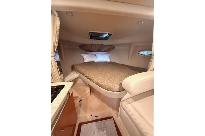 Slide: The Image of Interior cabin of 2003 Formula 31 Performance Cruiser with cozy bed and compact design. - 21