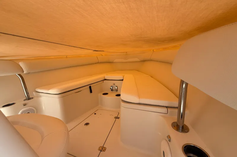Slide: The Image of Interior cabin of 2015 Sailfish 240 CC boat with cushioned seating. - 10