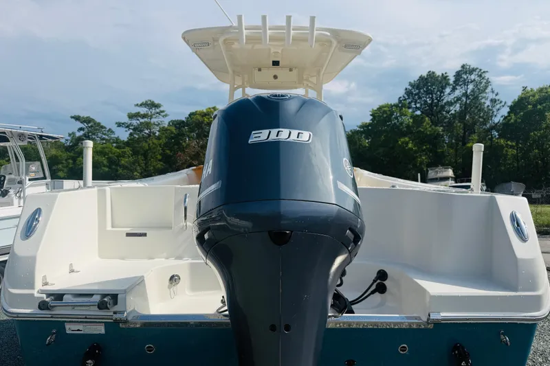 Slide: The Image of 2015 Sailfish 240 CC boat with Yamaha 300 engine, parked outdoors. - 5