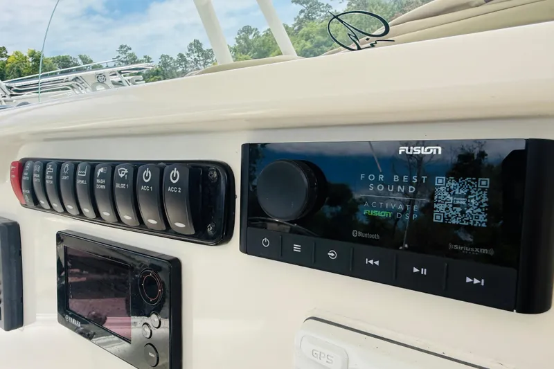 Slide: The Image of Control panel of a 2015 Sailfish 240 CC boat with Fusion audio system. - 7