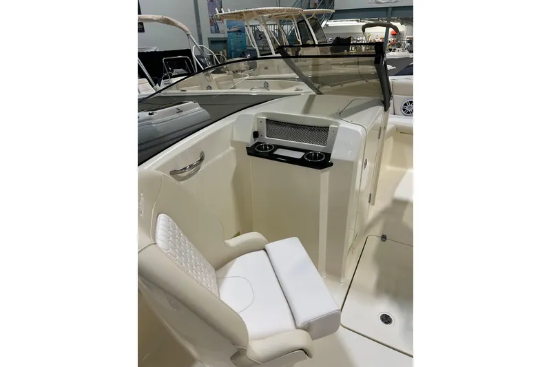 Slide: The Image of Interior view of 2026 Scout 220 Dorado boat with white seating and cup holders. - 4