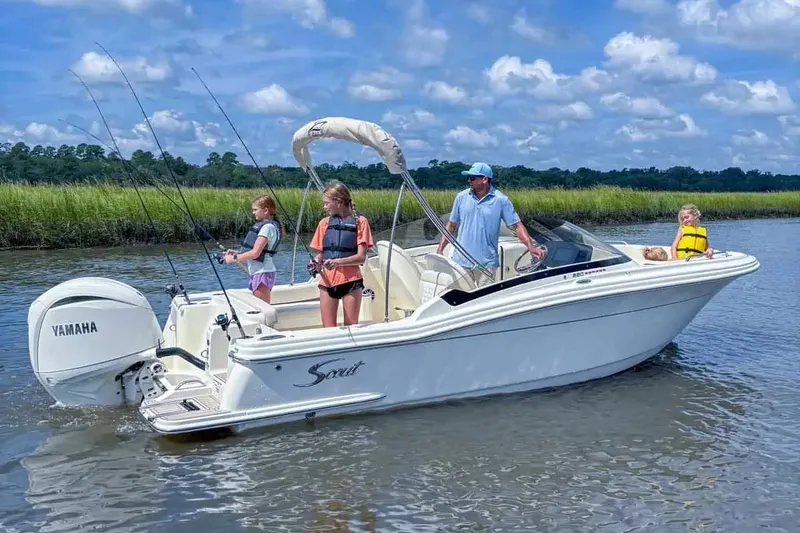 Slide: The Image of Manufacturer Provided Image: Family enjoying fishing on 2026 Scout 220 Dorado boat in scenic waters. - 9