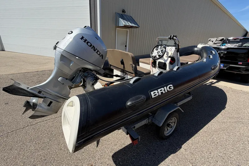 Slide: The Image of 2022 Brig Falcon 420 inflatable boat with Honda outboard motor on trailer. - 12