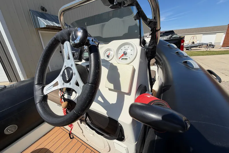 Slide: The Image of Steering console of 2022 Brig Falcon 420 boat with gauges and controls. - 18