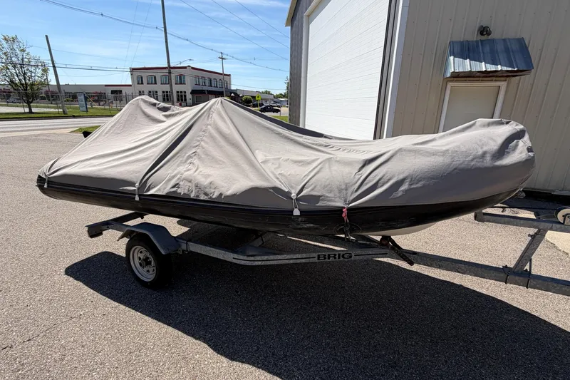Slide: The Image of Covered 2022 Brig Falcon 420 boat on trailer in parking lot. - 23