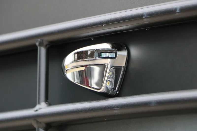 Slide: The Image of Close-up of a 2026 Sylvan Mirage 822 LZ boat detail, featuring a chrome component. - 16
