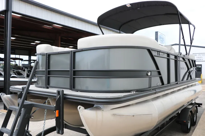 Slide: The Image of 2026 Sylvan Mirage 822 LZ pontoon boat on trailer, under canopy. - 17