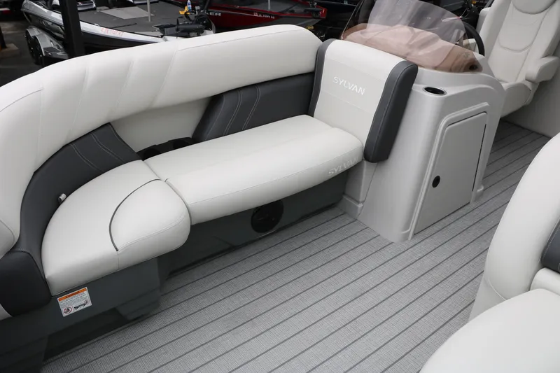 Slide: The Image of 2026 Sylvan Mirage 822 LZ boat interior with plush seating and modern design. - 21