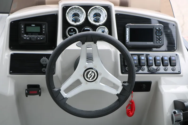 Slide: The Image of Steering console of 2026 Sylvan Mirage 822 LZ with gauges and controls. - 23