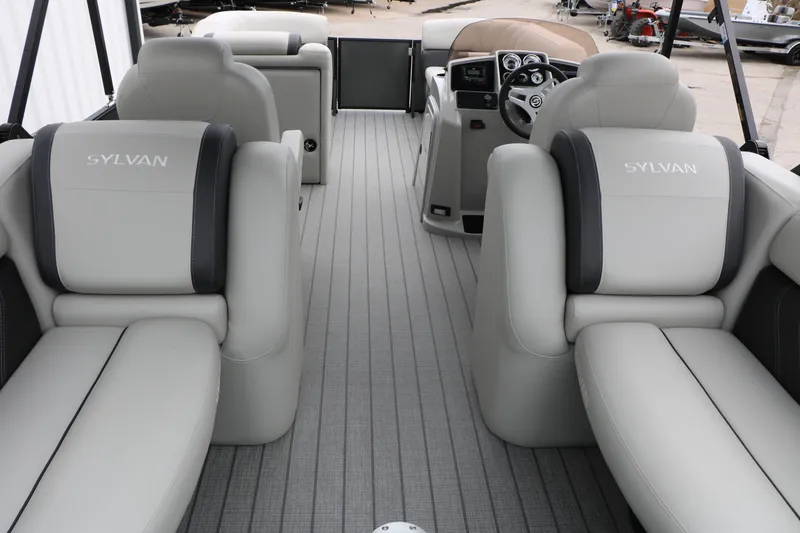 Slide: The Image of 2026 Sylvan Mirage 822 LZ pontoon boat interior with luxurious seating and modern dashboard. - 31