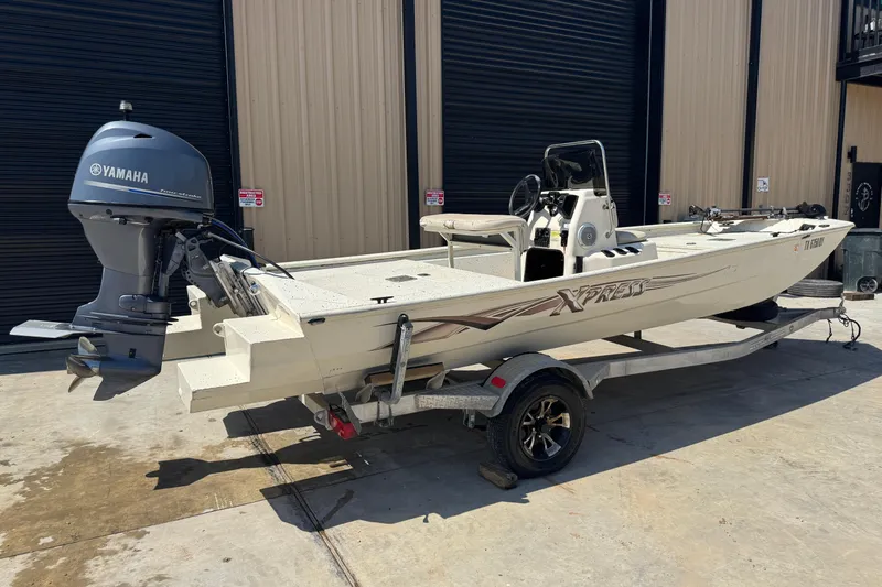 Slide: The Image of 2017 Xpress XP18CC boat with Yamaha outboard motor on trailer. - 11