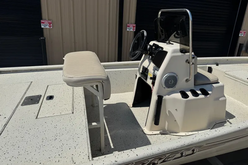 Slide: The Image of 2017 Xpress XP18CC boat interior with steering console and seating. - 3