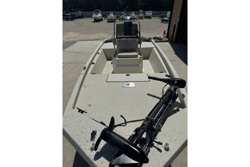 Slide: The Image of 2017 Xpress XP18CC boat with trolling motor, parked outdoors. - 5