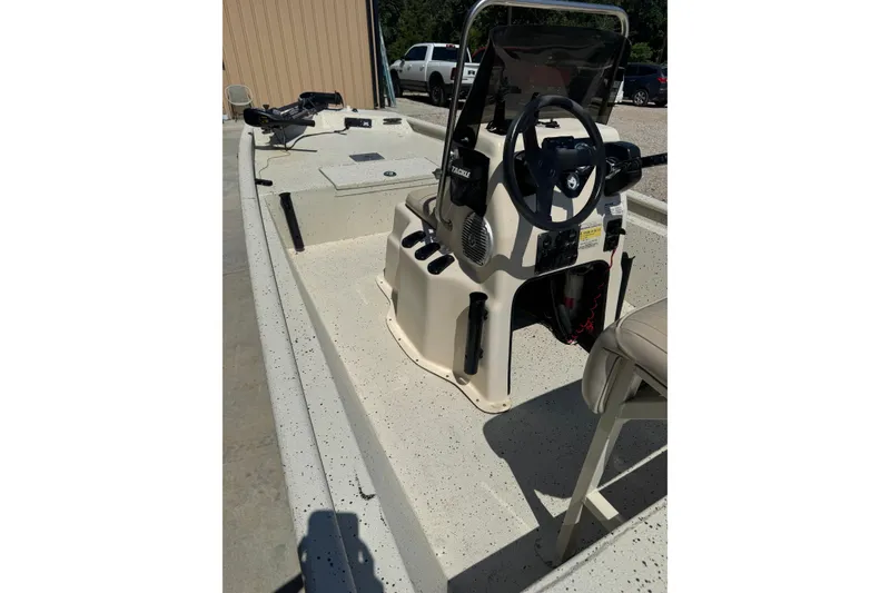 Slide: The Image of 2017 Xpress XP18CC boat interior with steering console and seating. - 6