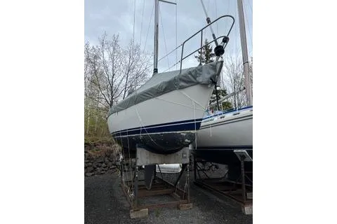 Slide: The Image of 1988 Tartan 31 sailboat on stands, covered and ready for maintenance. - 10