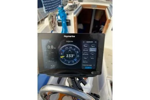 Slide: The Image of Raymarine navigation display on 1988 Tartan 31 sailboat, showing compass heading of 233 degrees. - 9