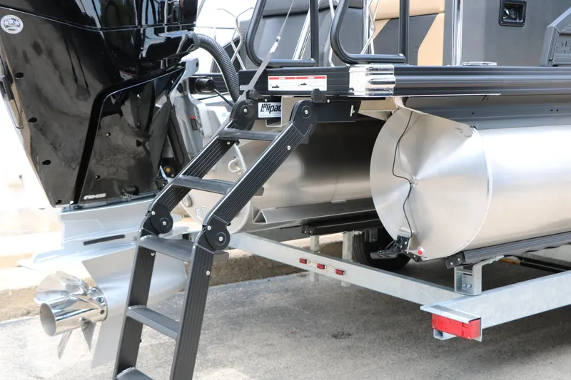 Slide: The Image of Rear view of 2026 Evotti 725 CS Arch Tri-Toon boat with ladder and motor. - 11