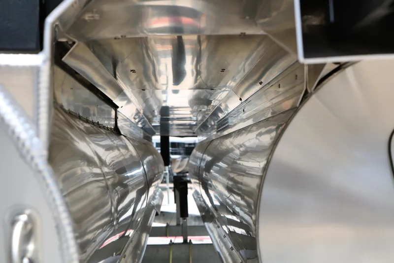 Slide: The Image of Interior view of 2026 Evotti 725 CS Arch Tri-Toon, showcasing sleek metallic design. - 12