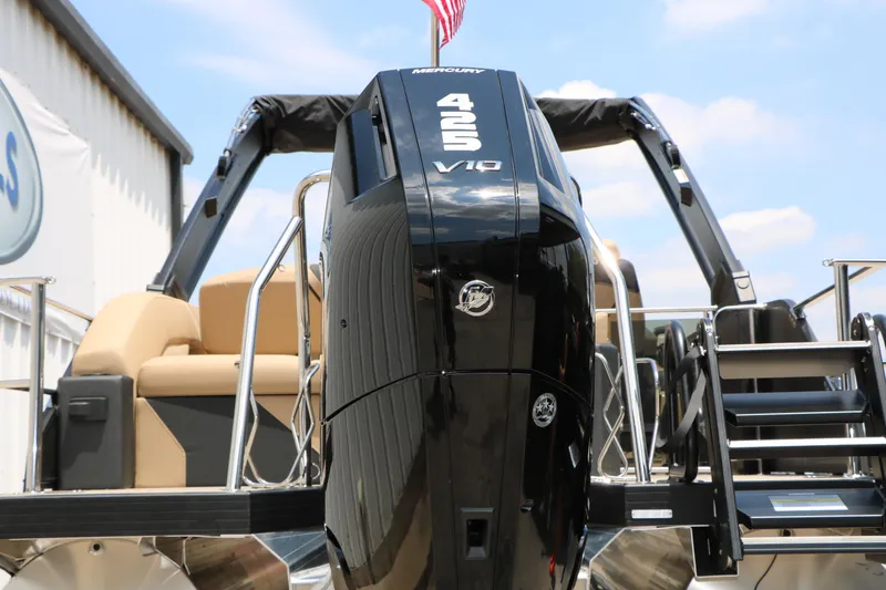 Slide: The Image of 2026 Evotti 725 CS Arch Tri-Toon with powerful Mercury 425 V10 engine, docked under blue sky. - 16
