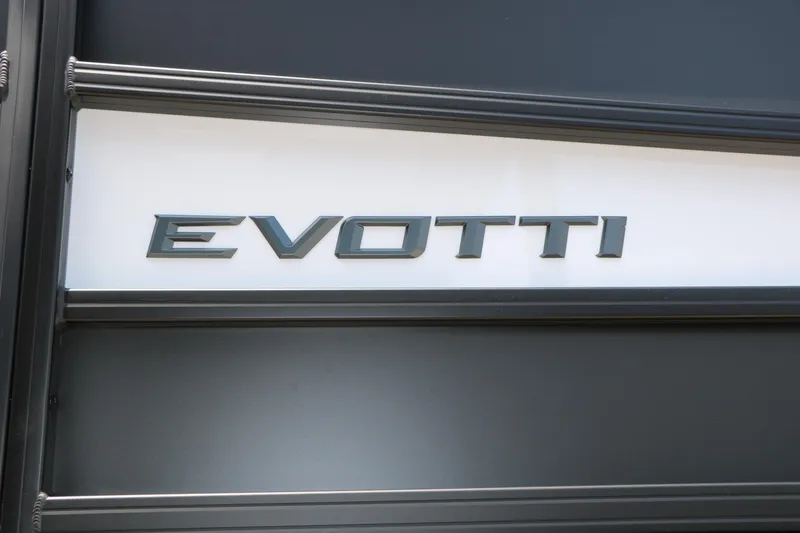Slide: The Image of Evotti 725 CS Arch Tri-Toon 2026 logo on sleek black and white surface. - 19