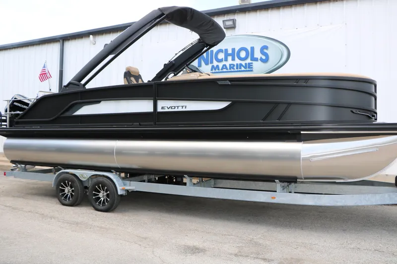 Slide: The Image of 2026 Evotti 725 CS Arch Tri-Toon boat on trailer at Nichols Marine dealership. - 2